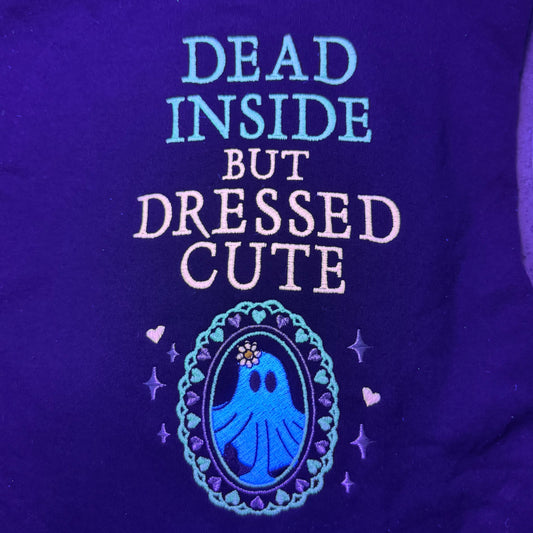 'Dead Inside But Dressed Cute' and a graphic design under the blacklight.
