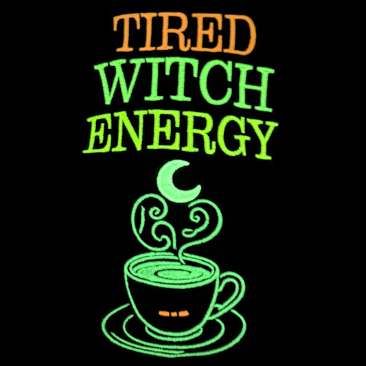 'Tired Witch Energy' with a witch hat graphic showing the glow in the dark features